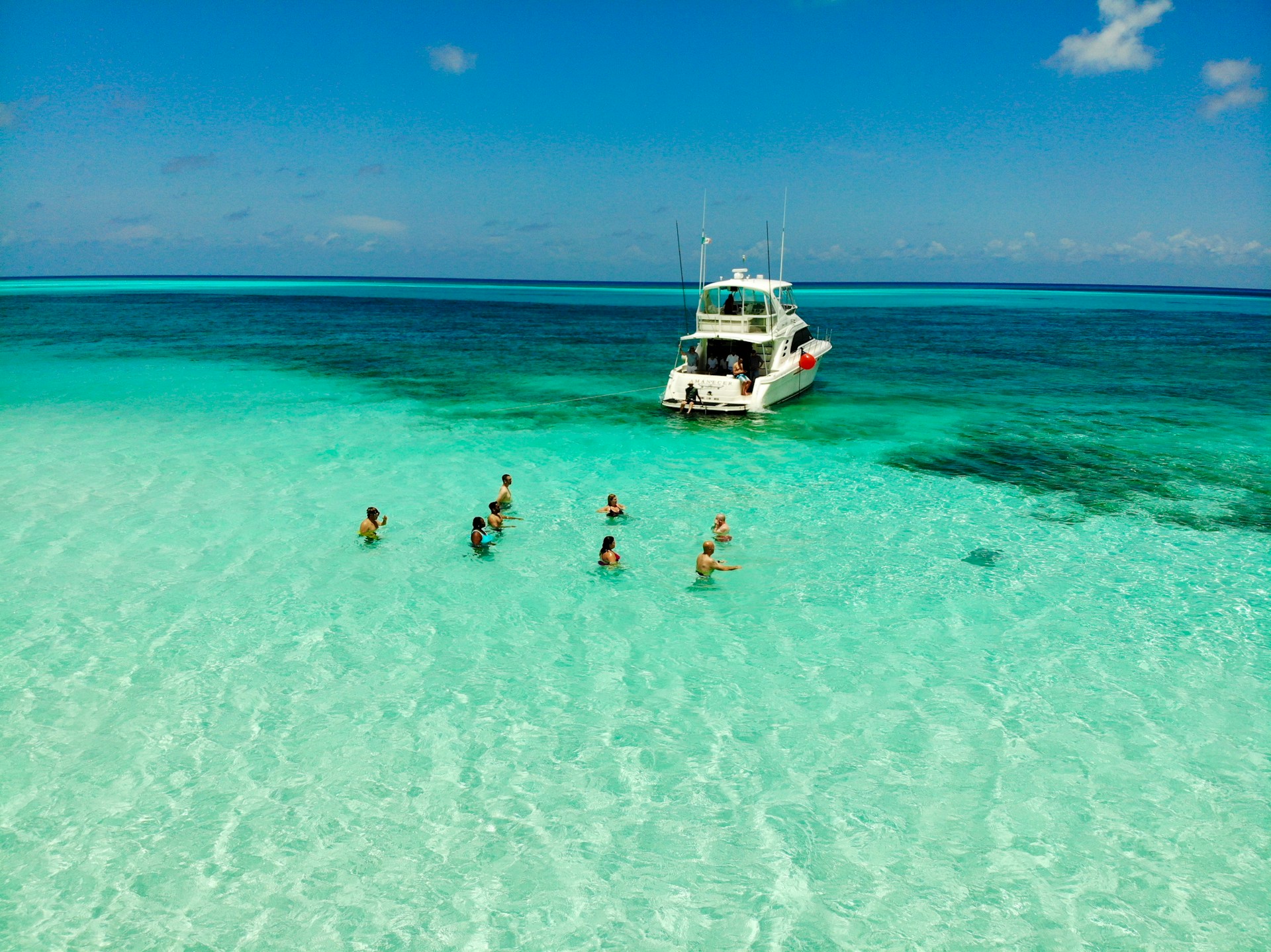 Tourists swimming in Cozumel beach