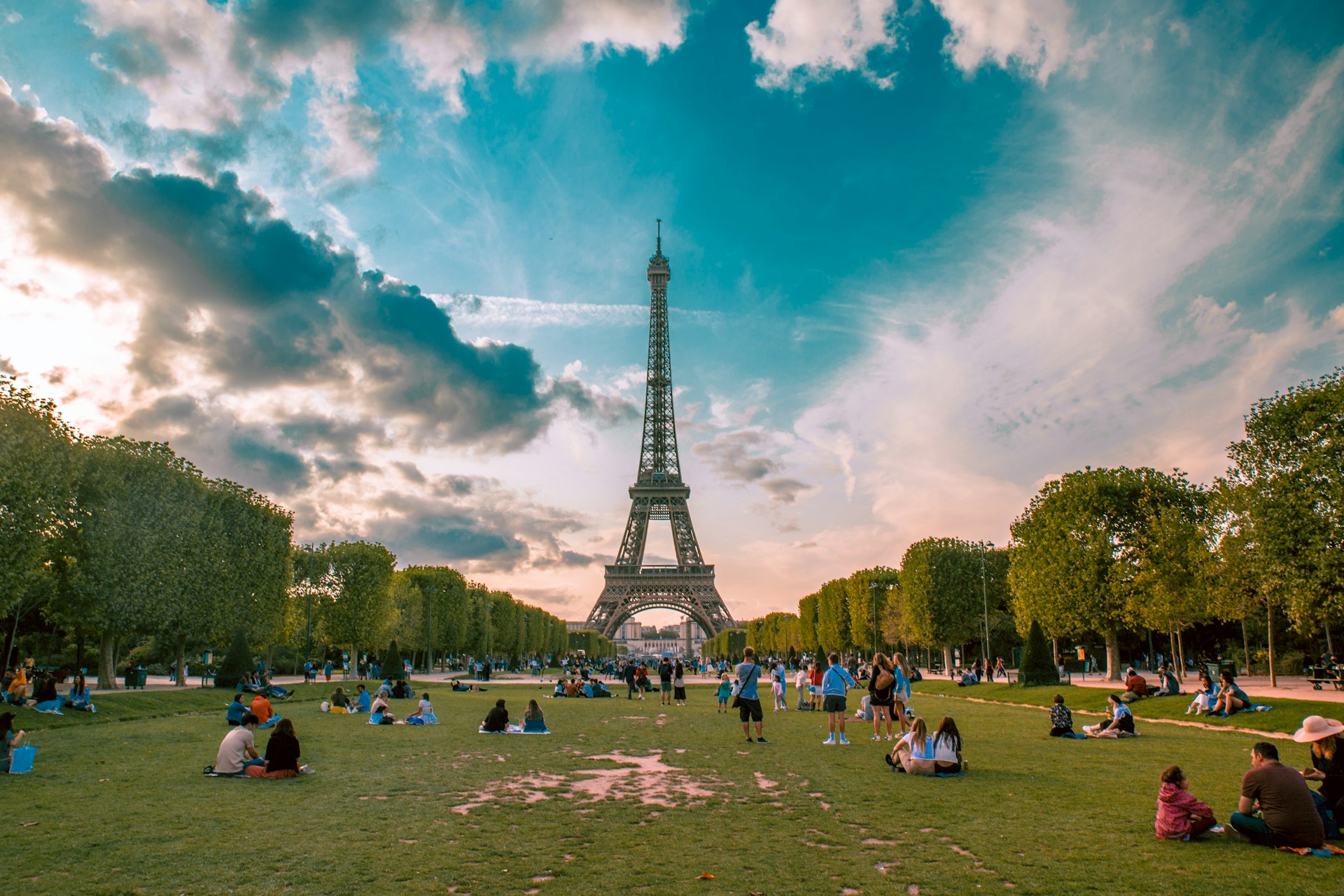 Eiffel Tower rising above the trees on a clear day in Paris,
