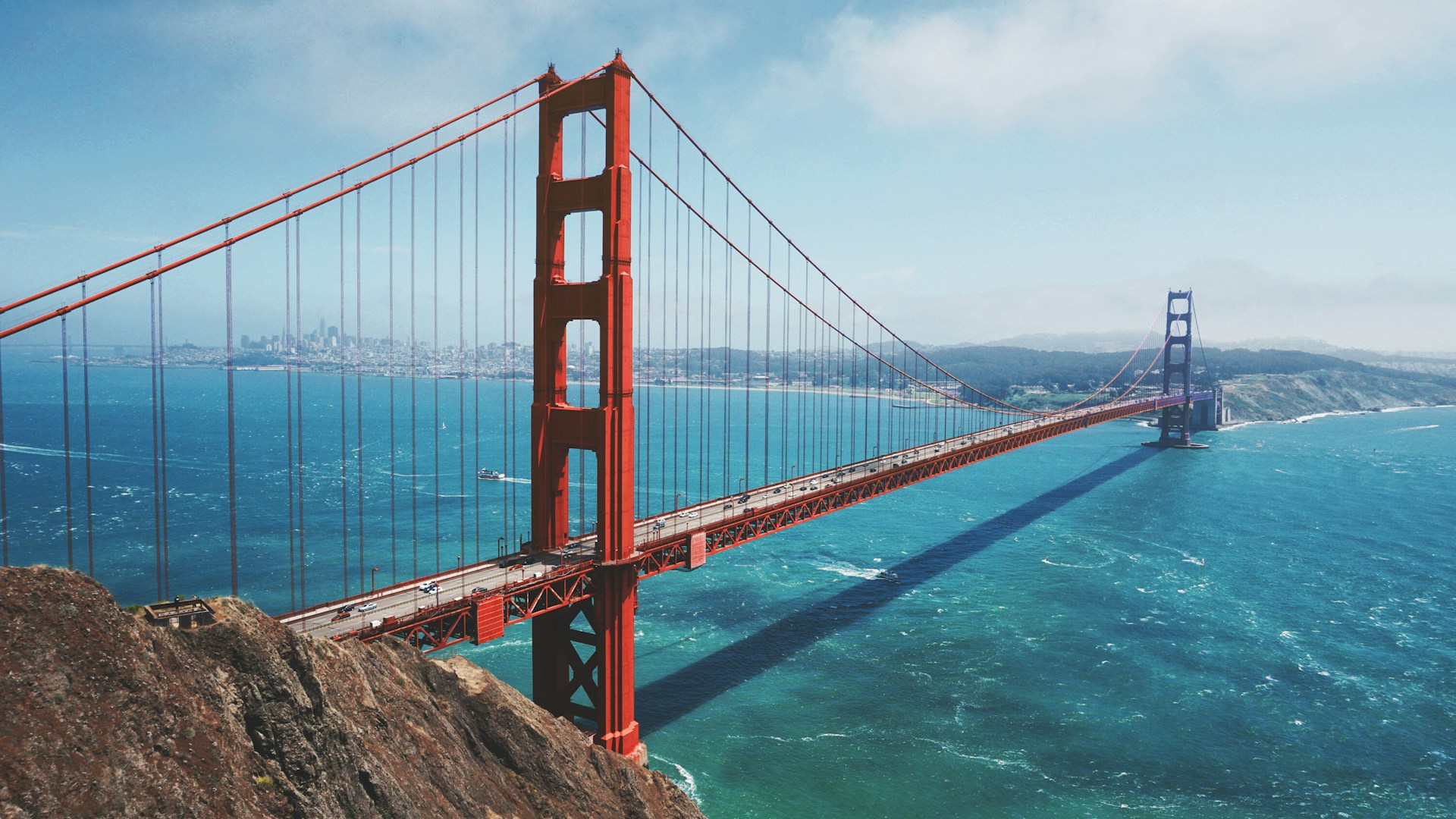 The Golden Gate Bridge stretching across the San Francisco Bay on a clear day.