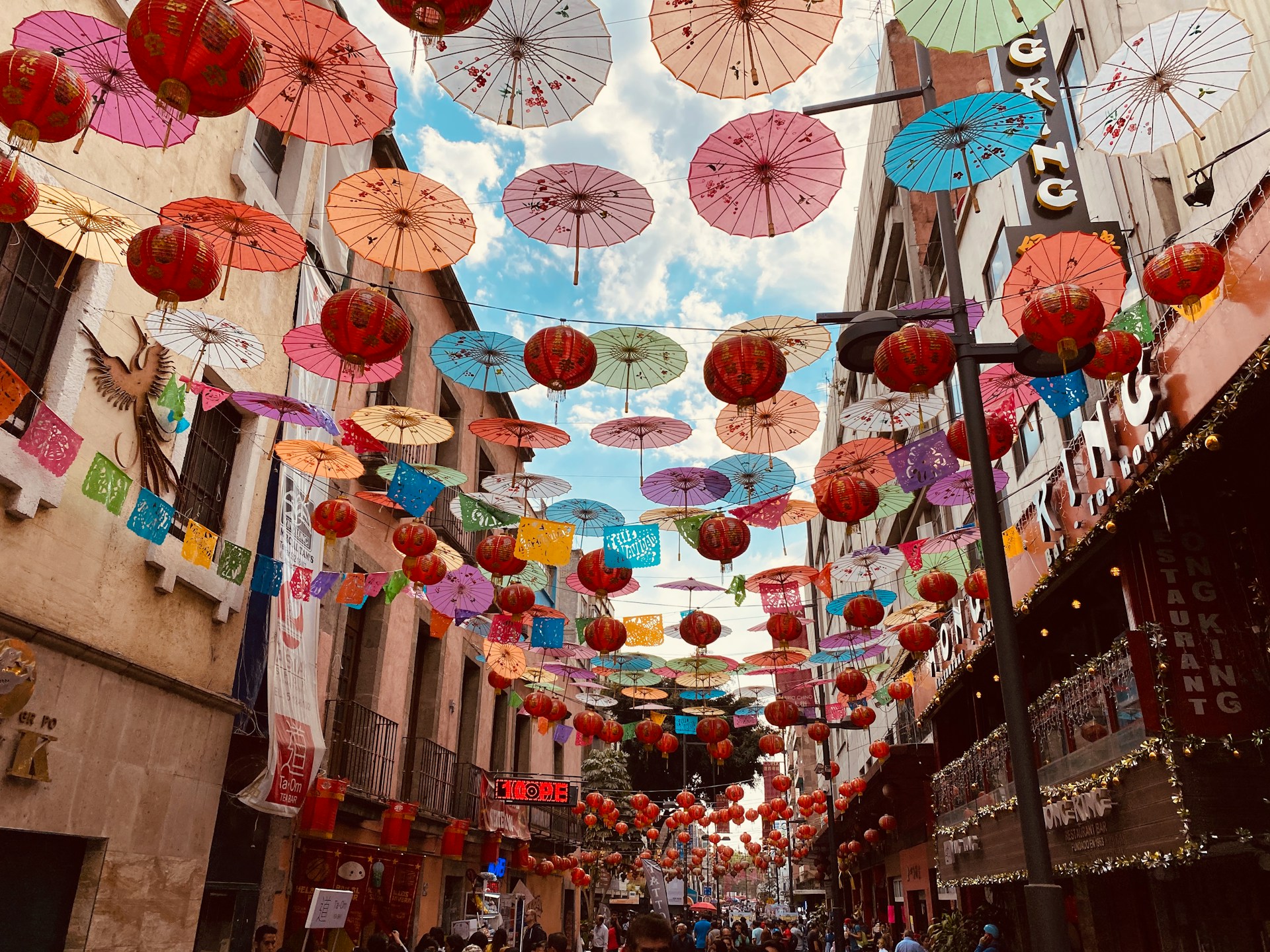 Vibrant canopy of colorful umbrellas suspended above a street in Mexico City