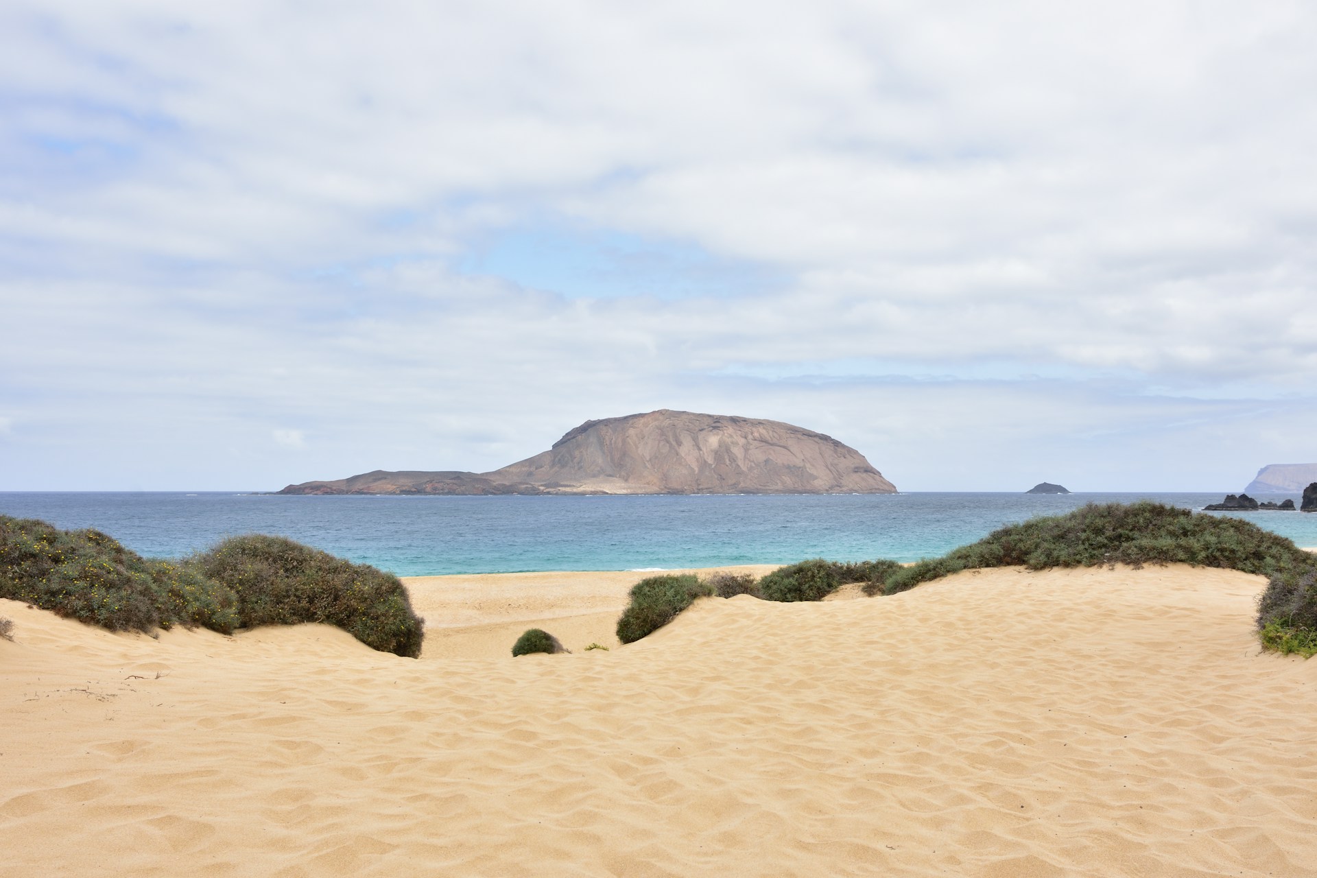 Distant view of Montaña Clara rising from the Atlantic