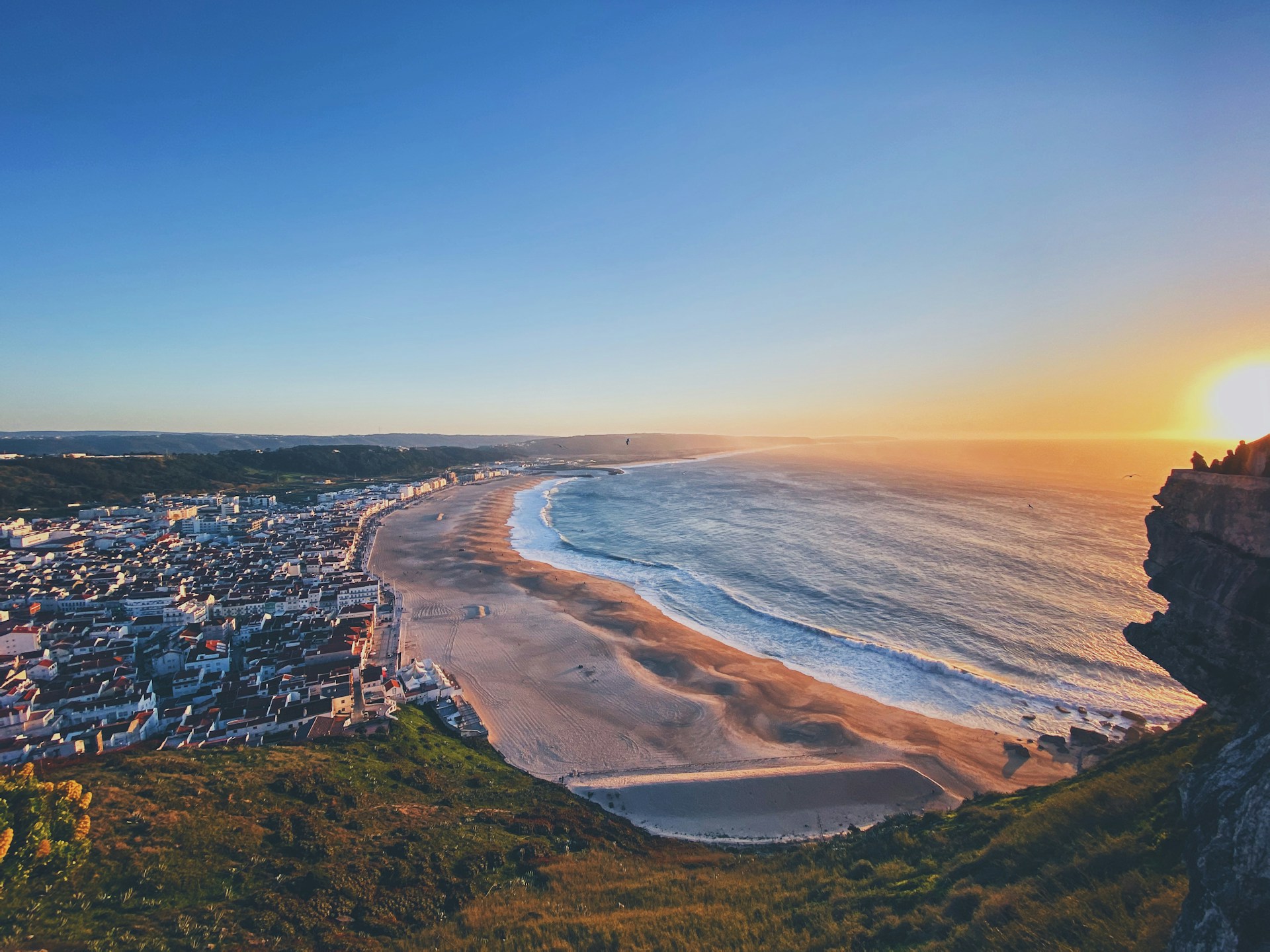 A sweeping view of Nazaré Beach in Portugal