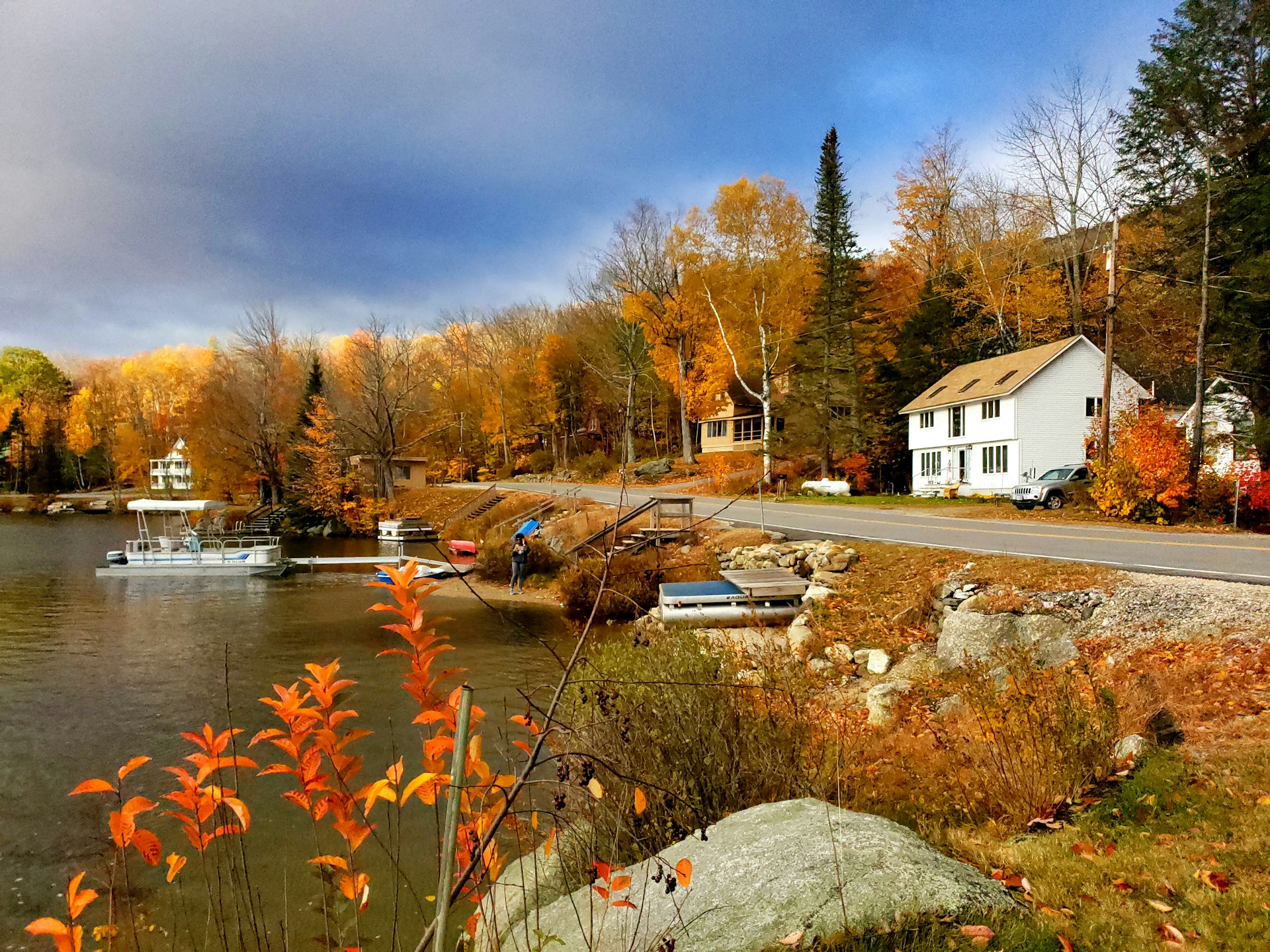 Peaceful river winding through a small New Hampshire village