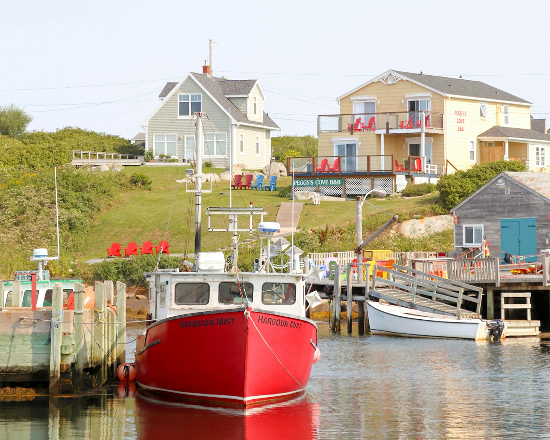 Quaint village in Nova Scotia with colorful houses nestled along the shore