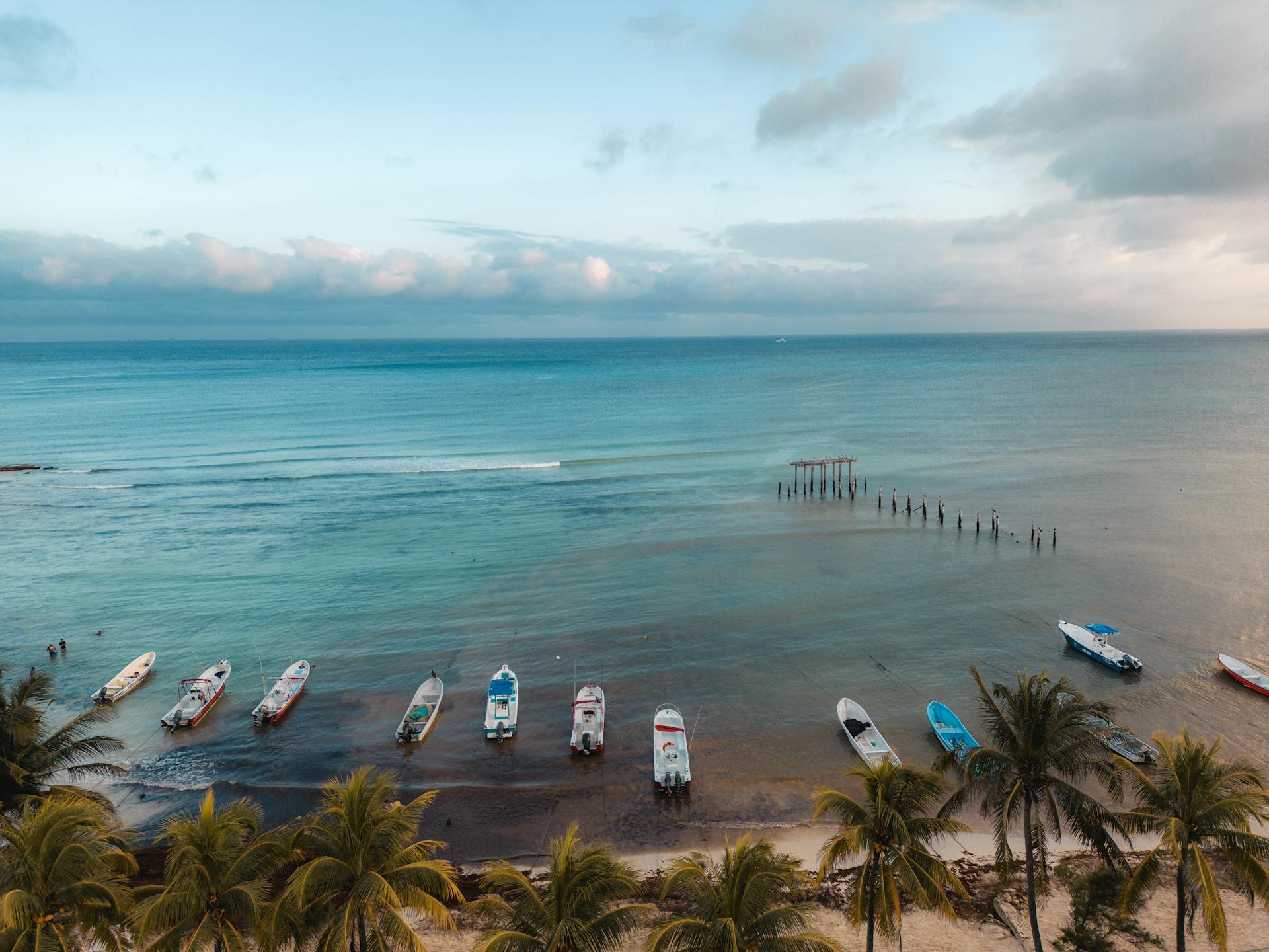 Pristine white sand stretching along the turquoise waters of Playa del Carmen