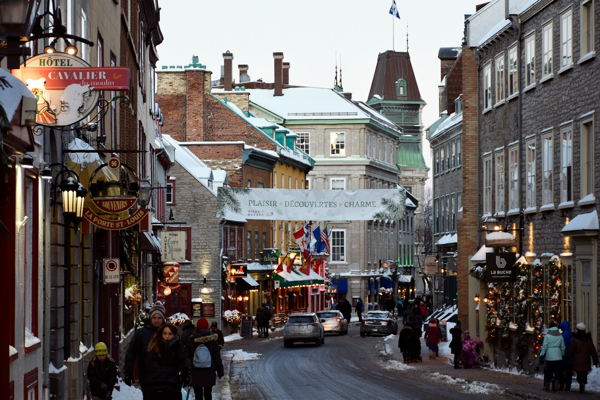 Snow-covered cobblestone street in Old Quebec City during Christmas