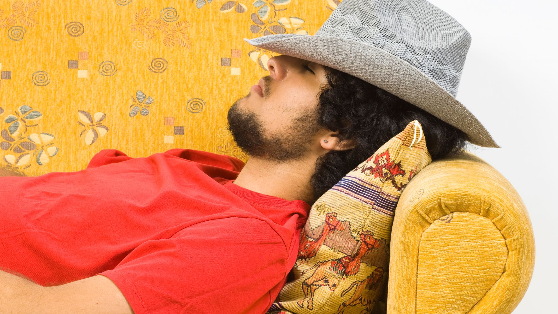 A man sleeping on a couch.