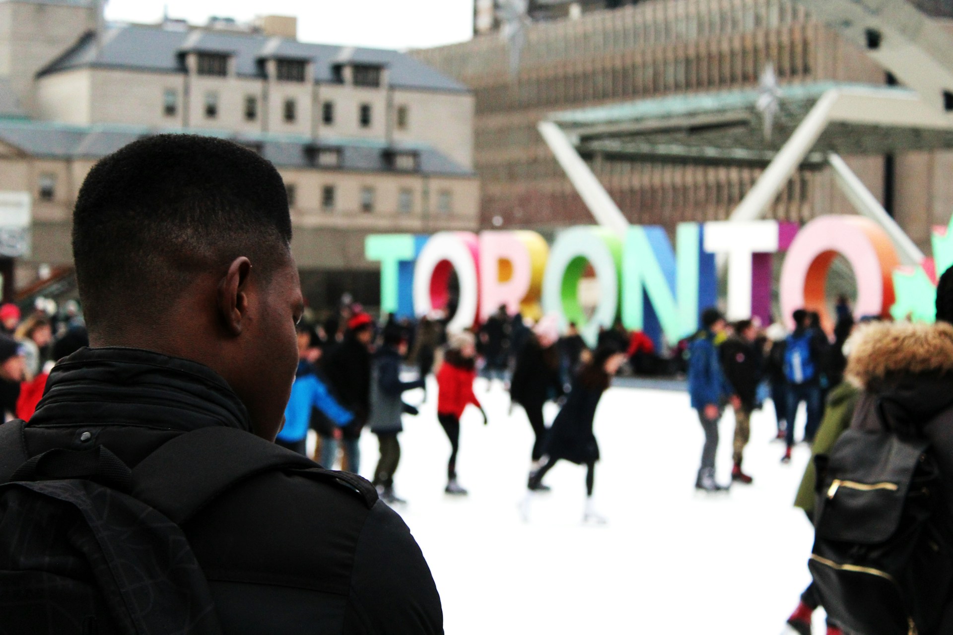 Snow-covered walkway in Toronto with bundled-up pedestrians