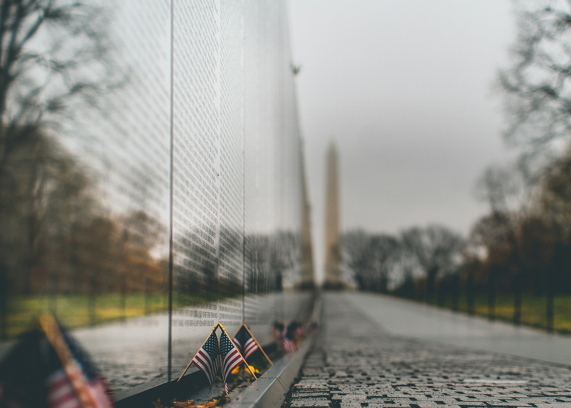 A solemn and respectful scene at the Vietnam Veterans Memorial in Washington D.C