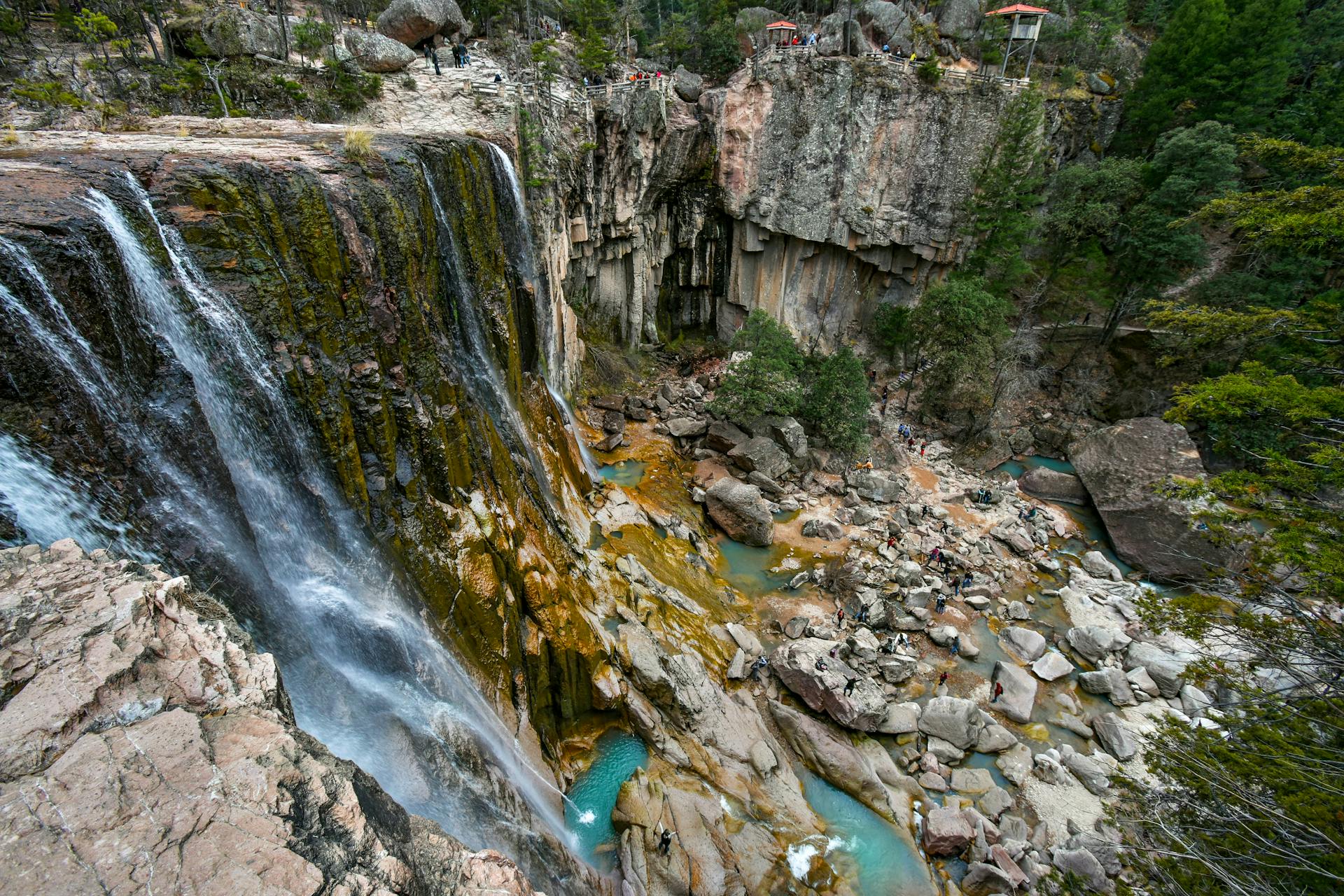 A tall waterfall cascading down a rugged cliffside in Chihuahua’s Sierra Madre