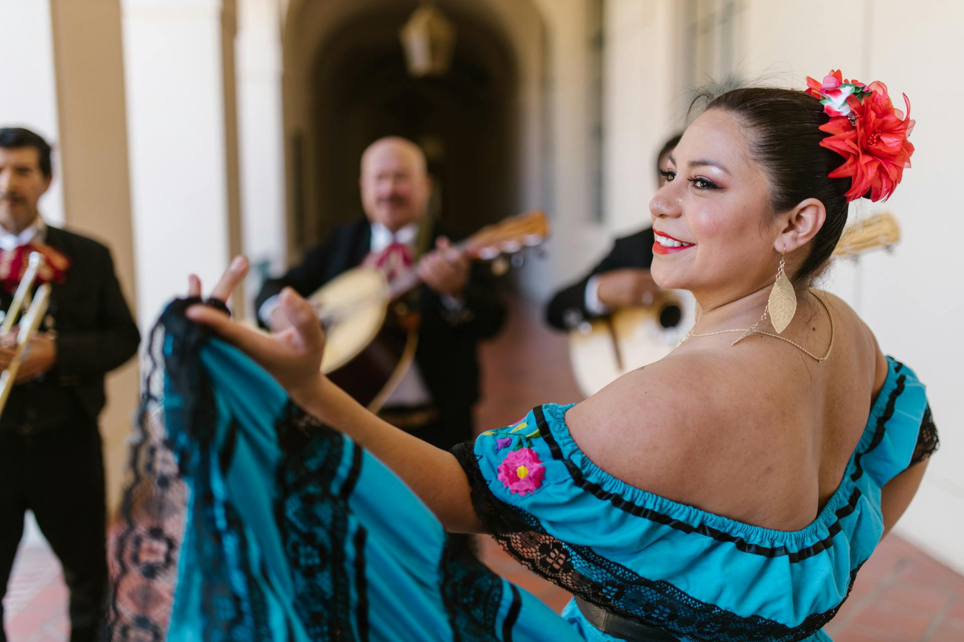 People dancing in traditional Mexican dress to celebrate Cinco de Mayo