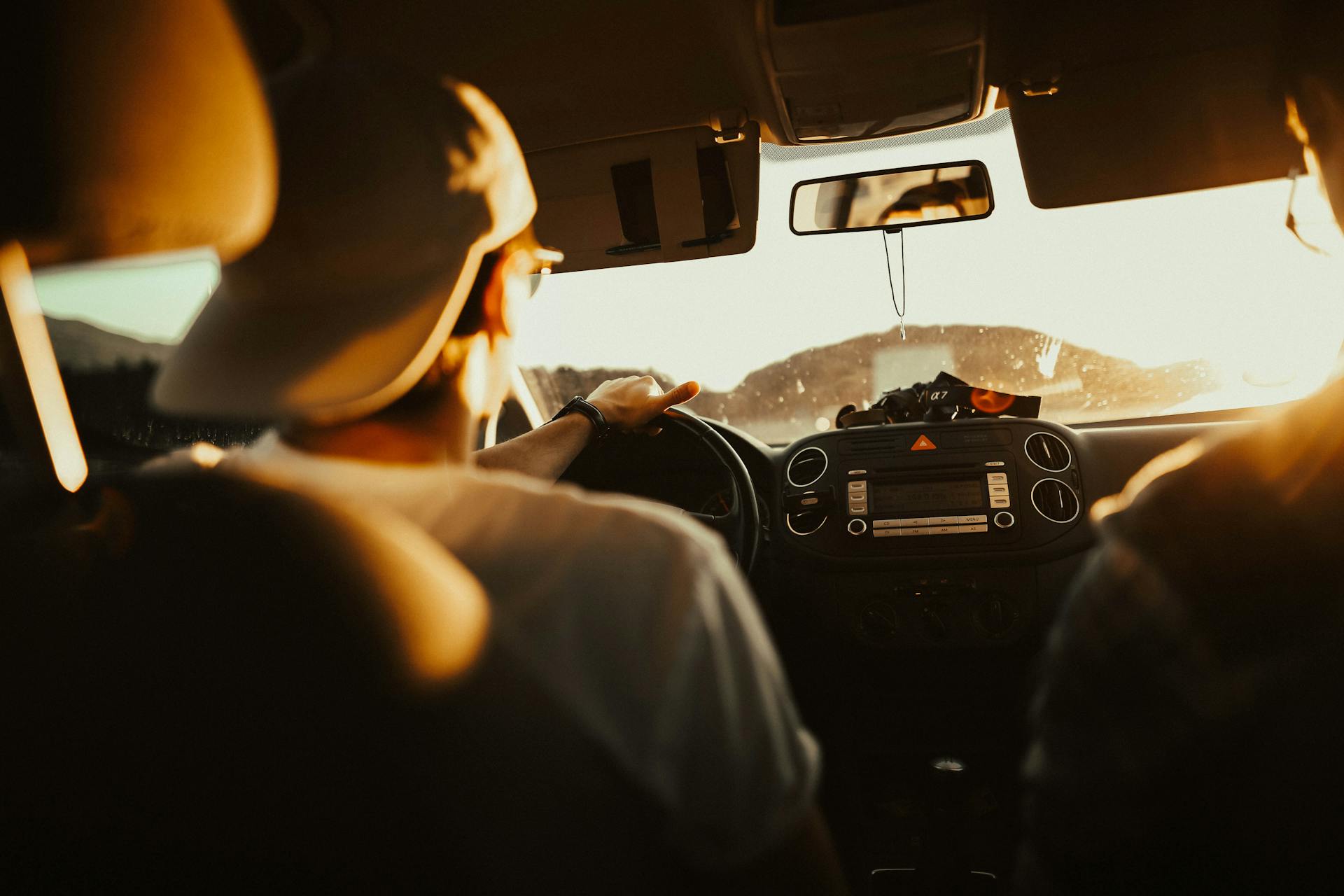 Driver and three passengers carpooling on a highway in Mexico,