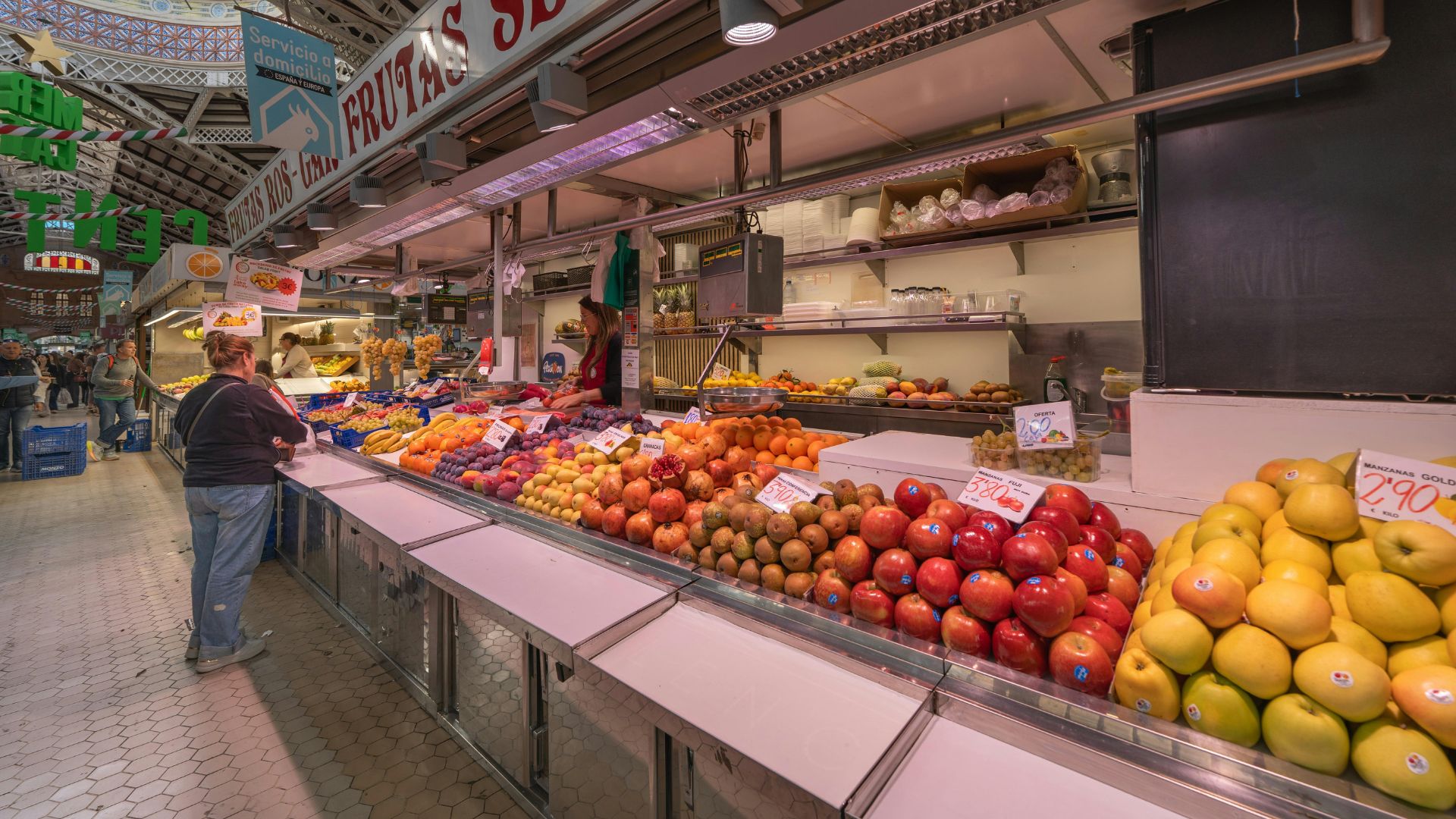A woman buying at a market