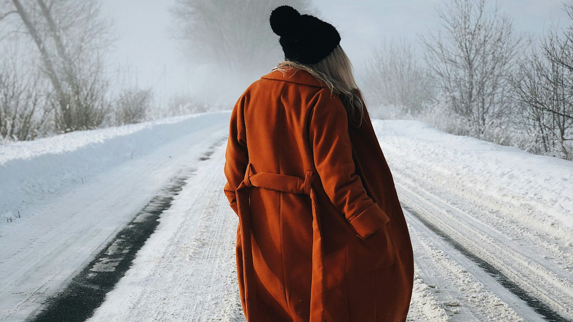 A woman on a winter road trip