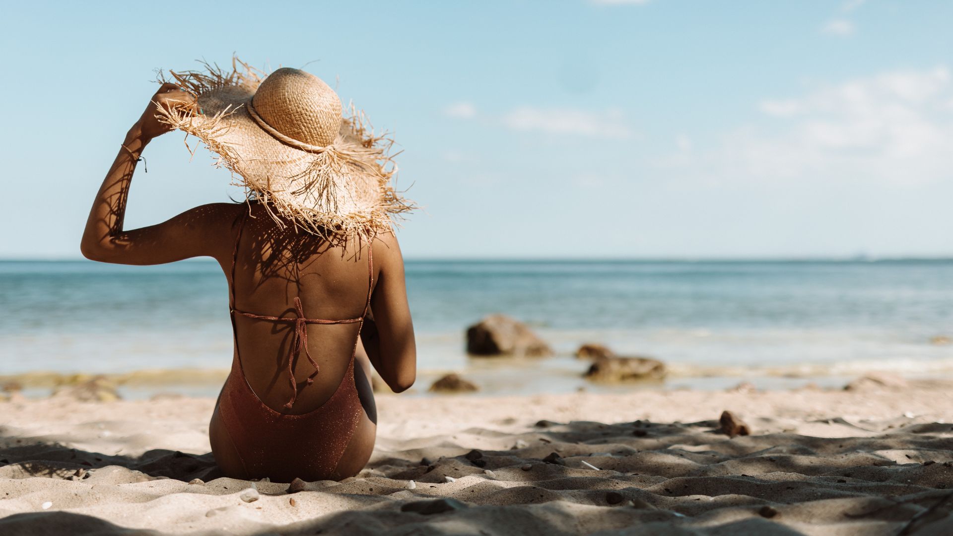 A woman relaxing on the beach