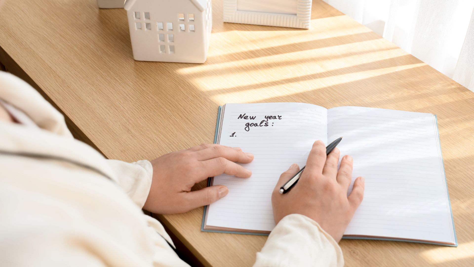 A woman writing new year's goals