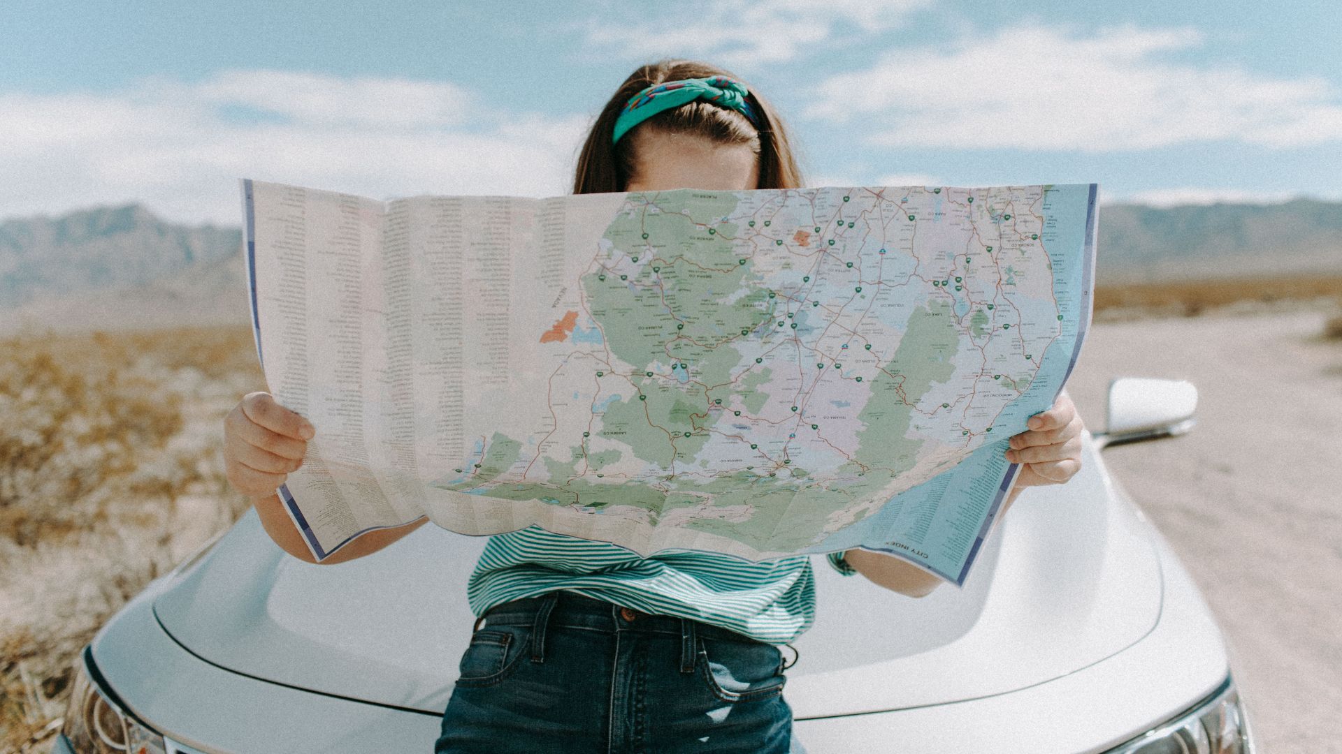 Woman checking map for travel